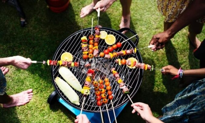 Tasteful Food On A Picnic With BBQ Transportable Grill